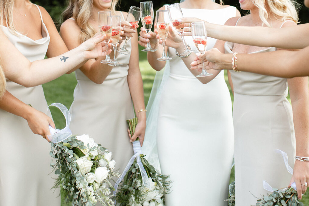 bridal party champagne toast post outdoor ceremony in Upstate New York