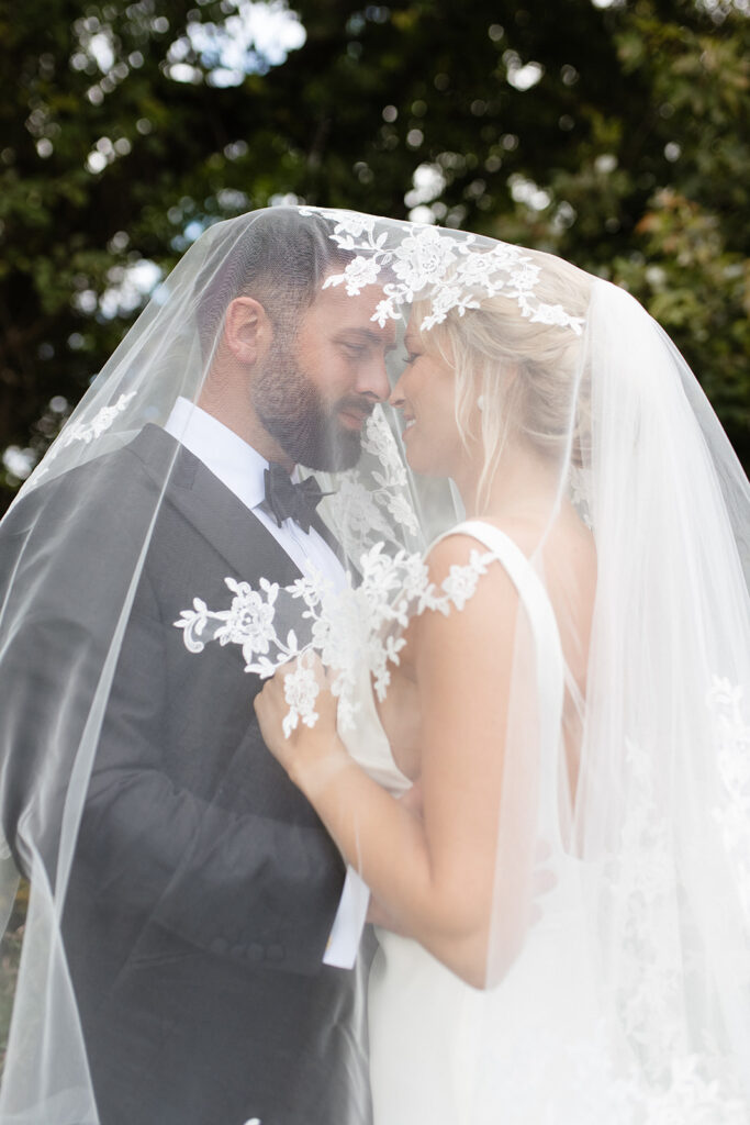 bride and groom portrait under an elegant veil in Upstate New York