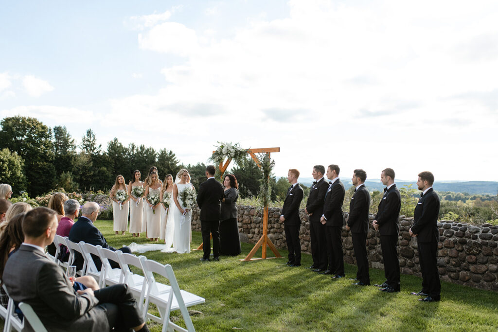 wedding parties lined up outside for an elegant wedding ceremony in Upstate New York