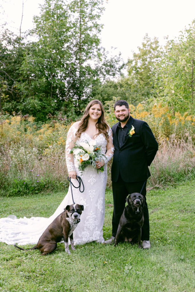 bride and groom take portraits outside at dog friendly wedding venue 