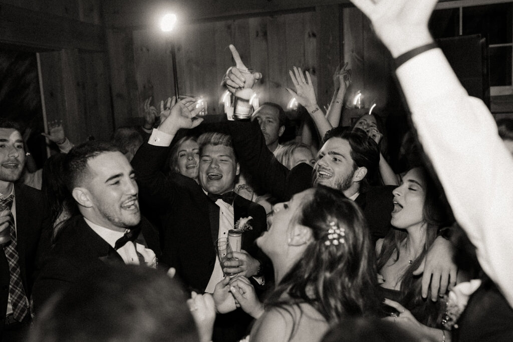 newlyweds and guests dancing at wedding reception in upstate new york 