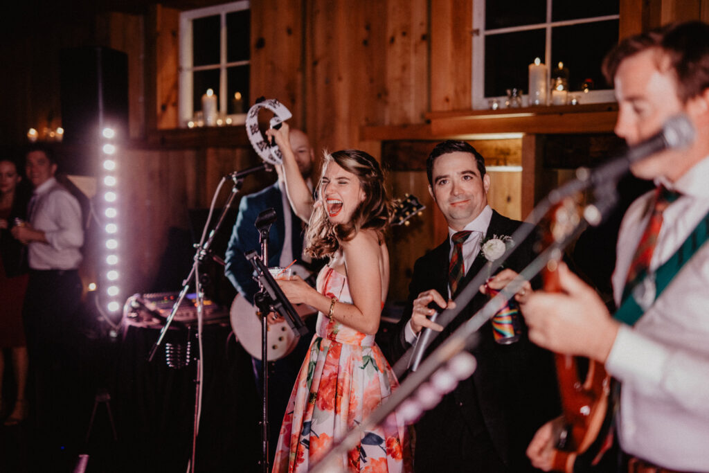 bride with band in barn wedding venue in upstate new york
