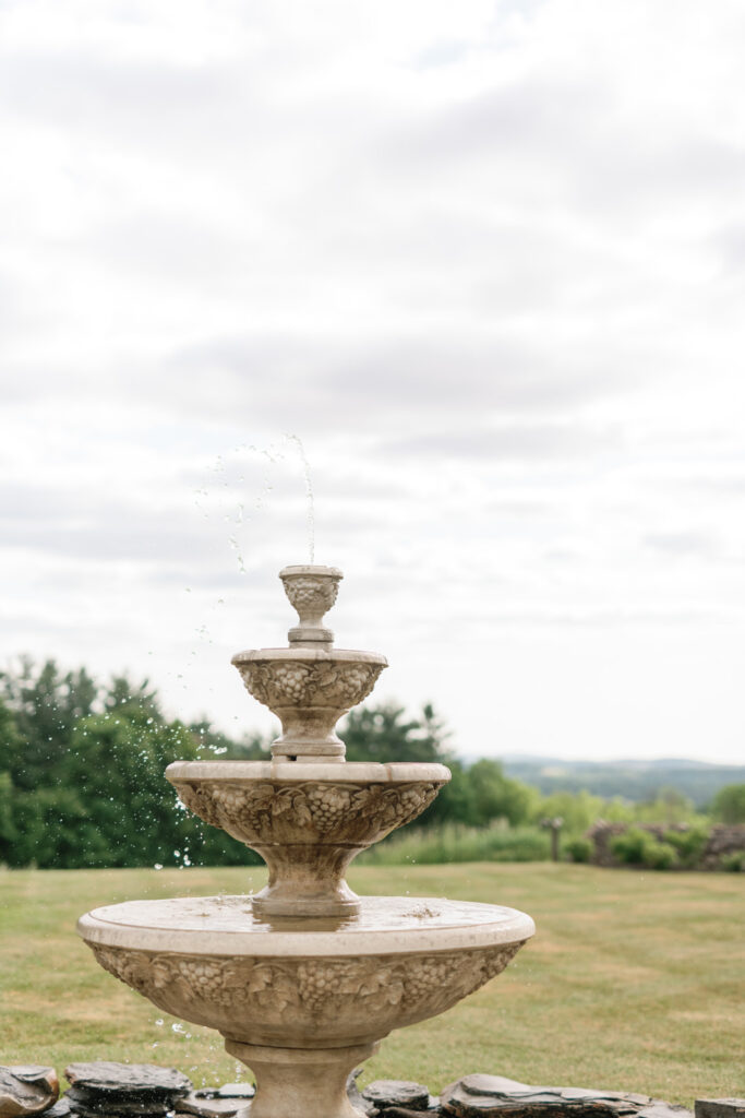 stone fountain on estate grounds in upstate new york